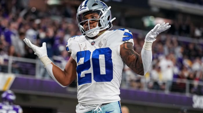 Nov 20, 2022; Minneapolis, Minnesota, USA; Dallas Cowboys running back Tony Pollard (20) celebrates his touchdown during the third quarter against the Minnesota Vikings at U.S. Bank Stadium. Mandatory Credit: Brace Hemmelgarn-USA TODAY Sports
